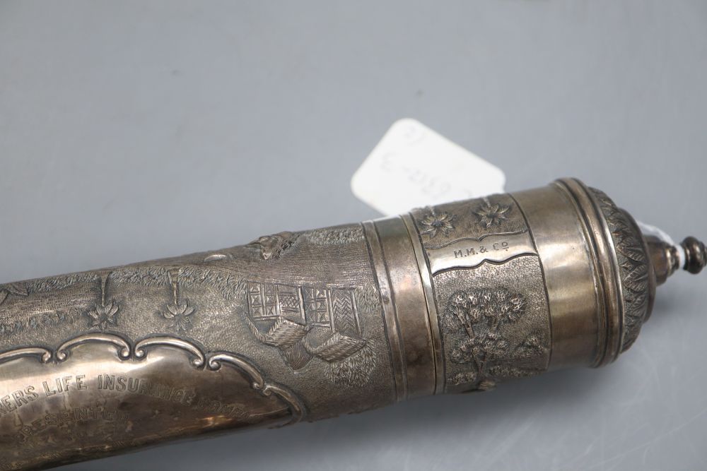 A 20th century Indian white metal scroll holder, 40.4cm and a white metal parasol handle, 16cm